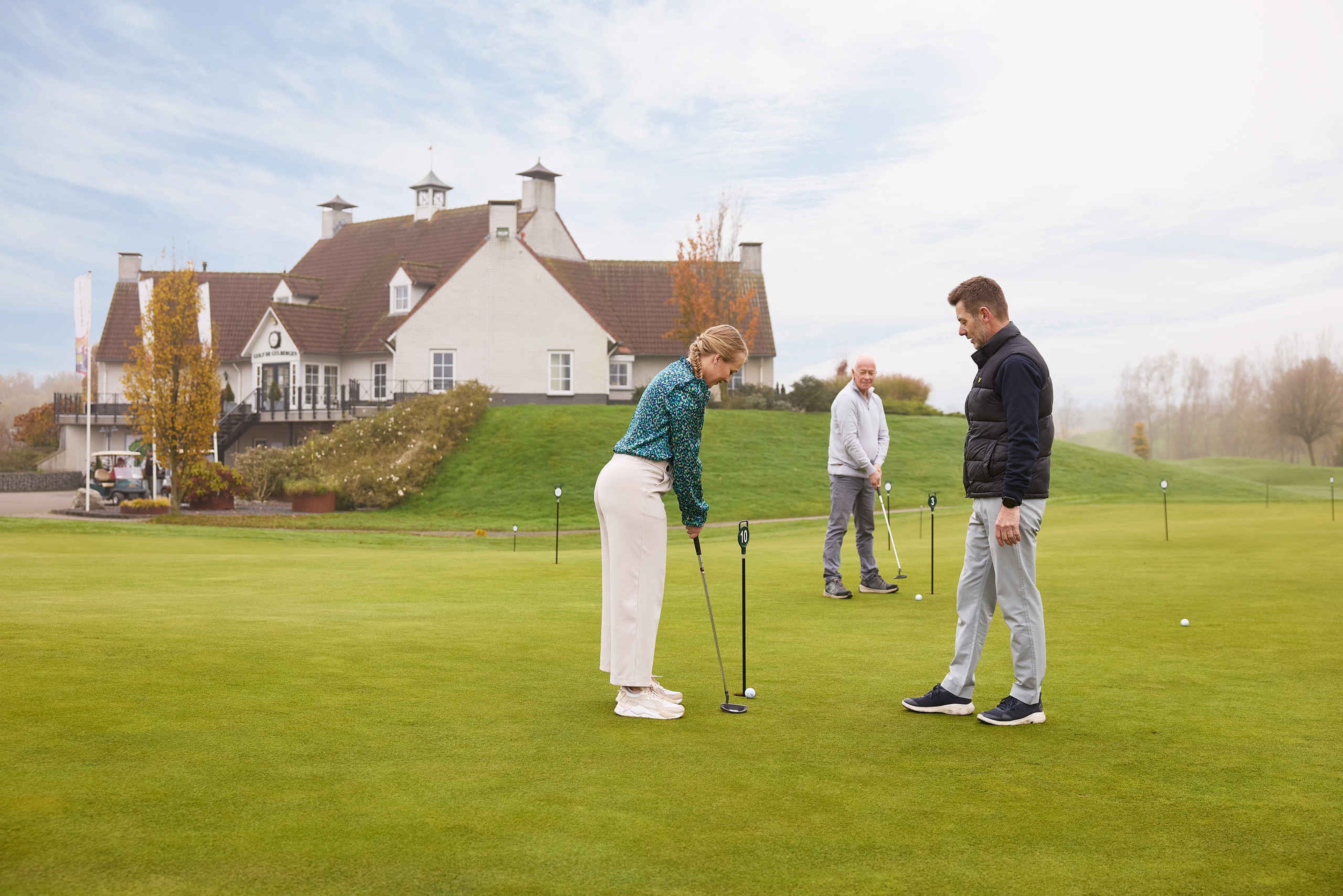 Vader dochter instructeur putten puttinggreen Golf De Gulbergen