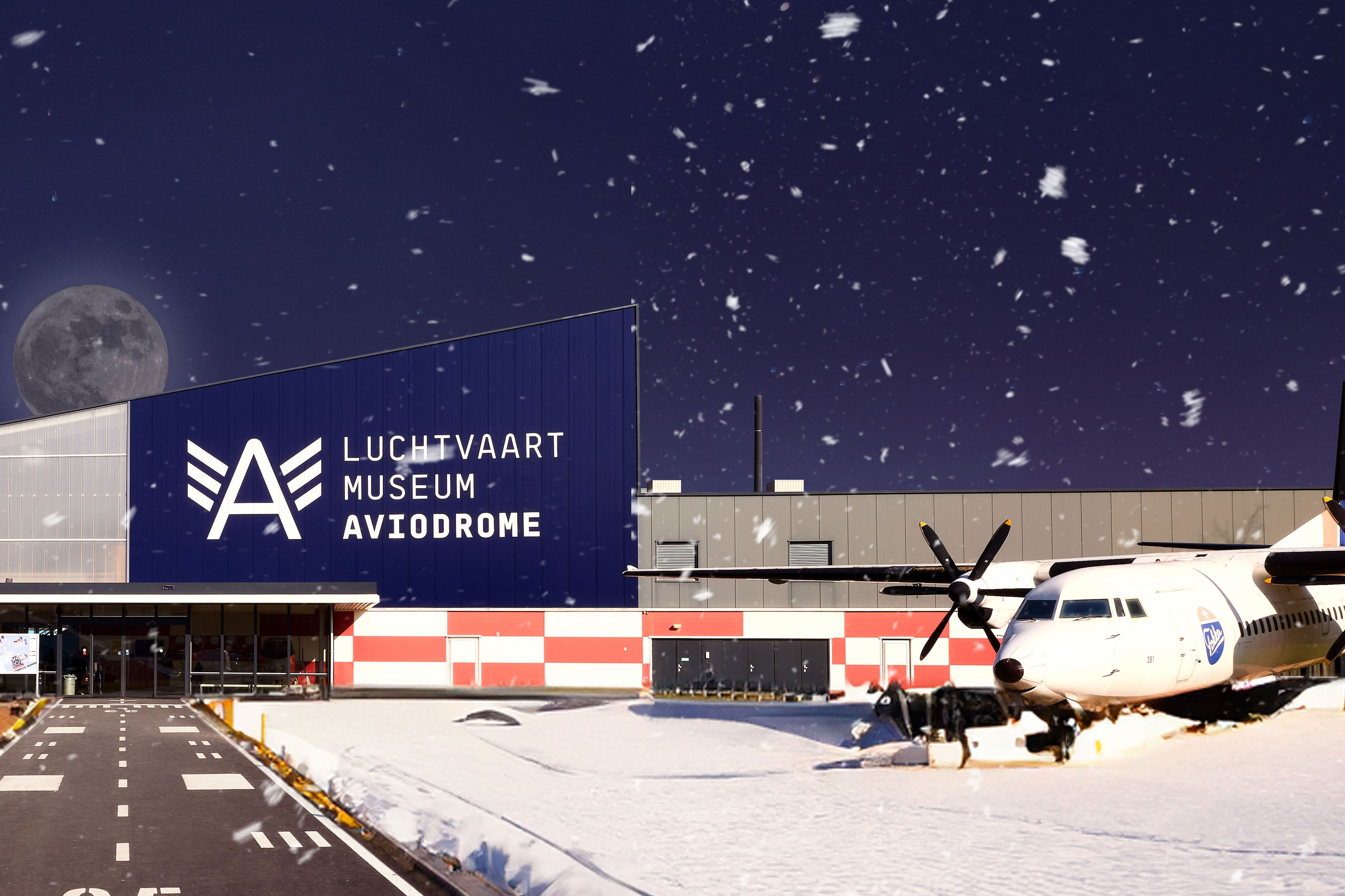 De entree van Aviodrome in een winterse setting
