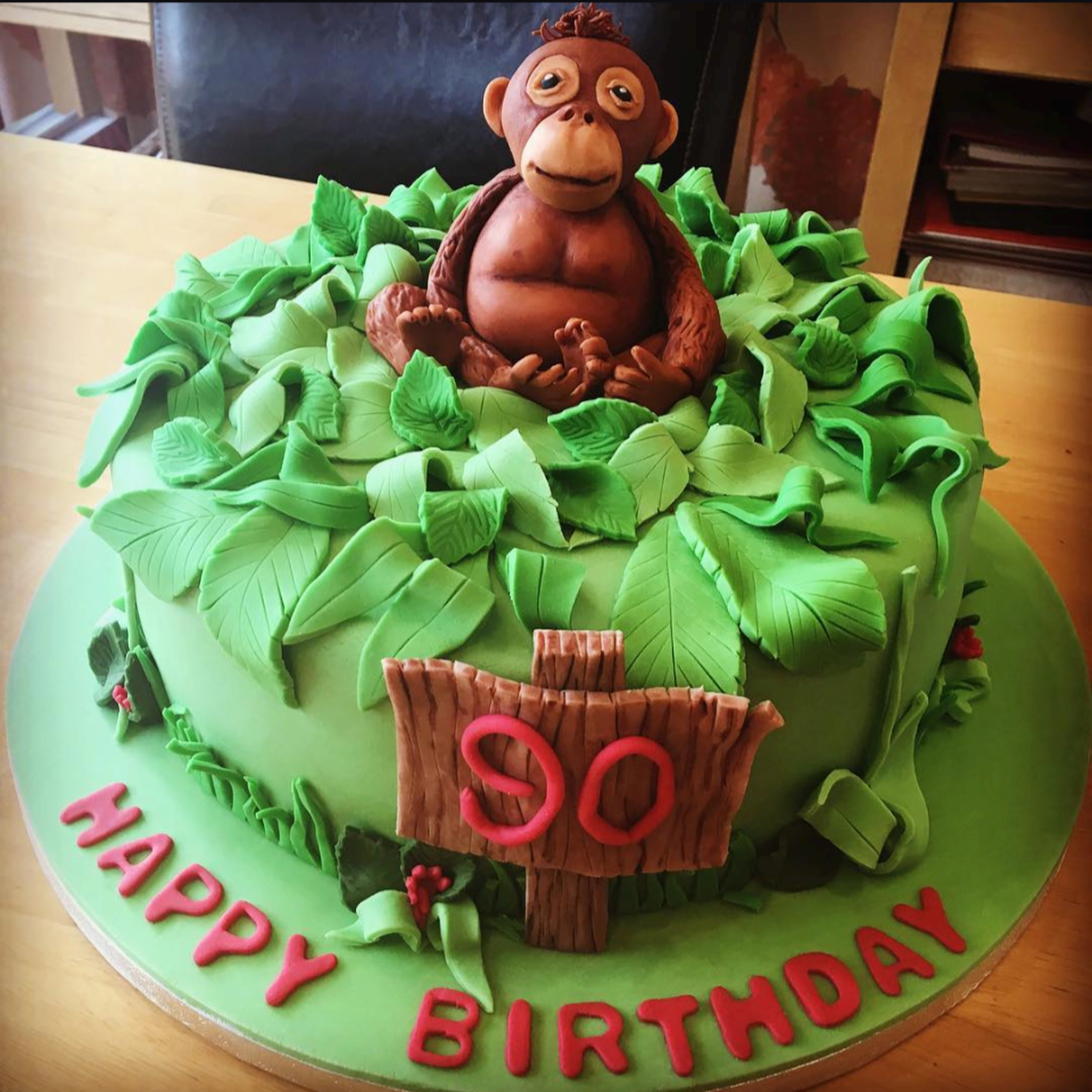 A green orangutan themed birthday cake made by zoo staff to celebrate David Attenborough's 90th birthday